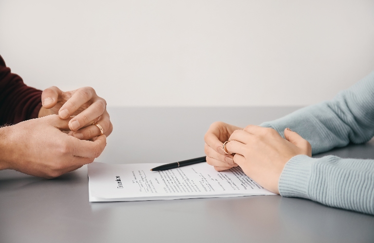 Couple with divorce decree in lawyer's office
