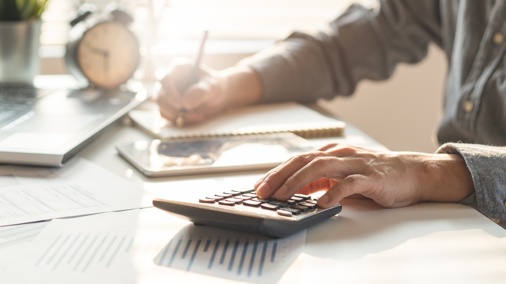 man is calculating taxes