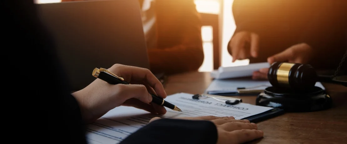 Client consulting with attorneys in a law office
